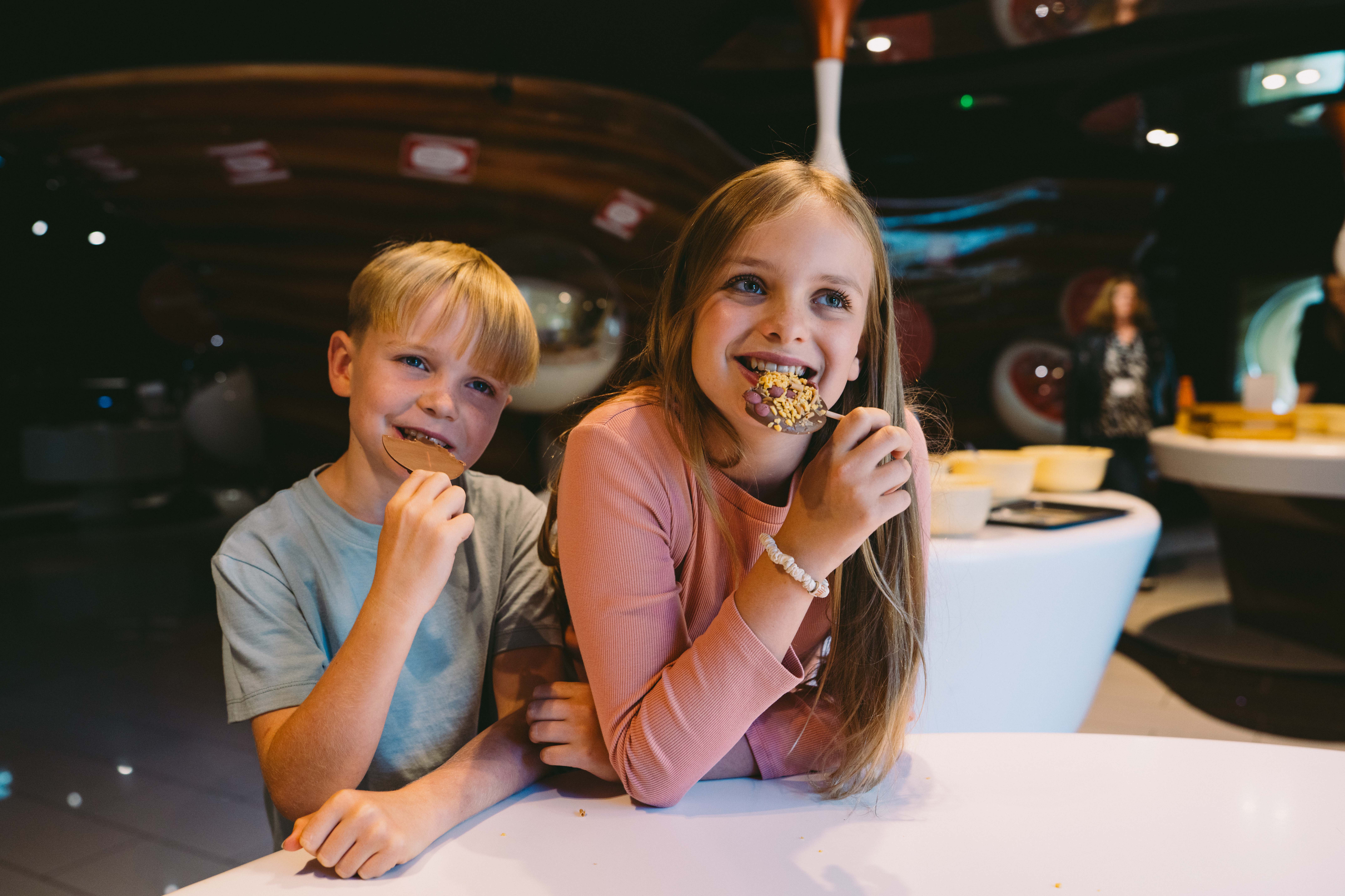 Children Sample The Chocolate Lollies They Created During A Tour